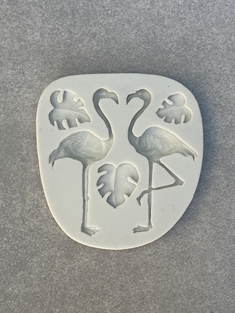 Molde de flamencos y hojas
